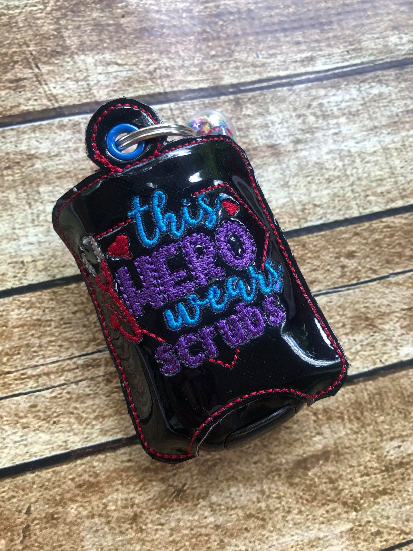 This Hero Wears Scrubs Sanitizer Holders - DIGITAL Embroidery DESIGN