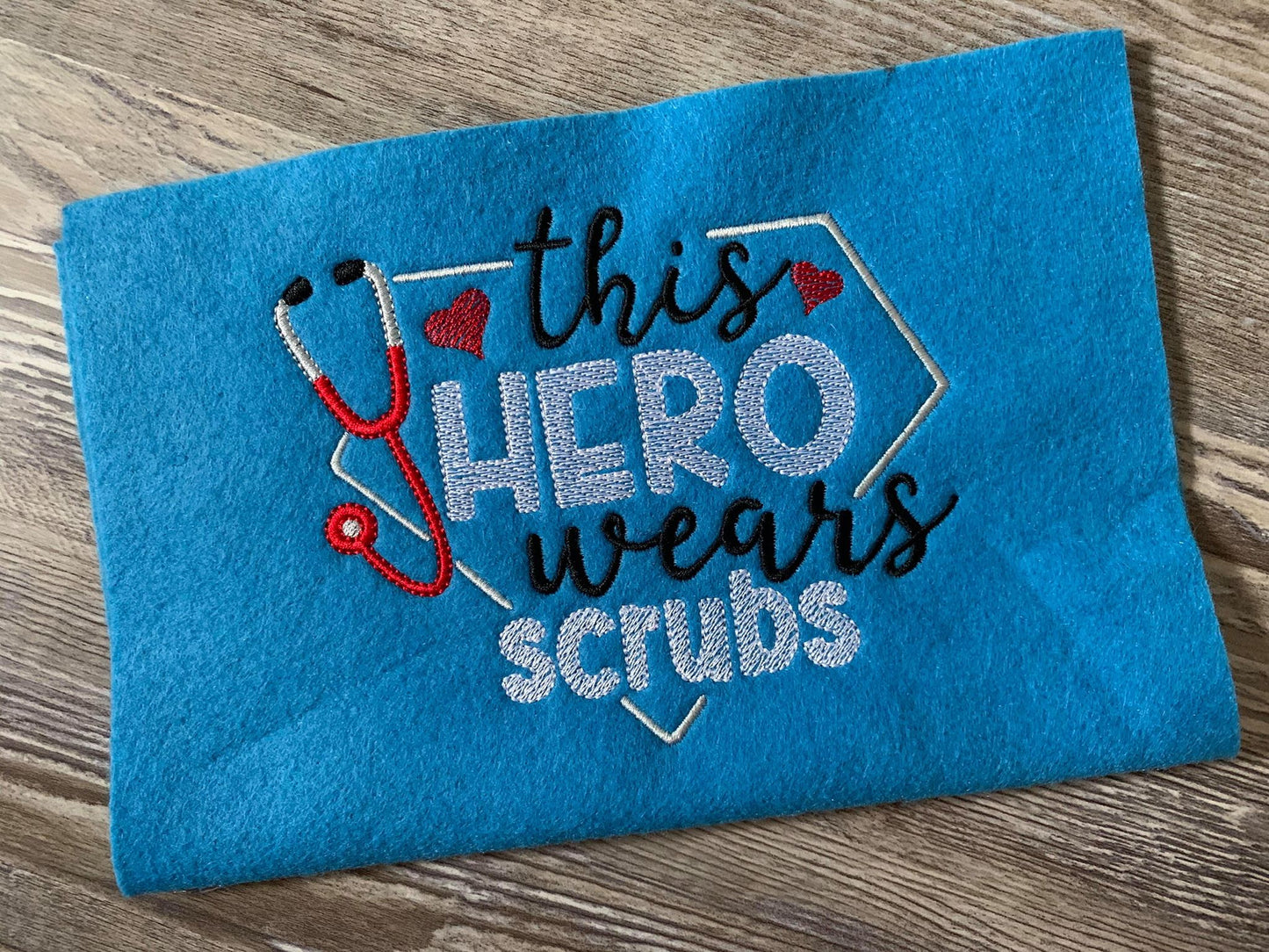 This hero wears scrubs - 3 Sizes - Digital Embroidery Design